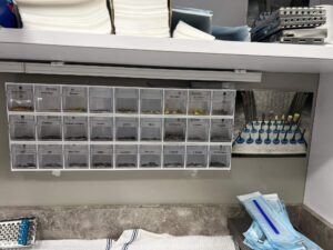 Organized dental burs in labeled storage bins