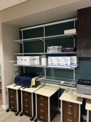 Stocked dental supply shelves and cabinets