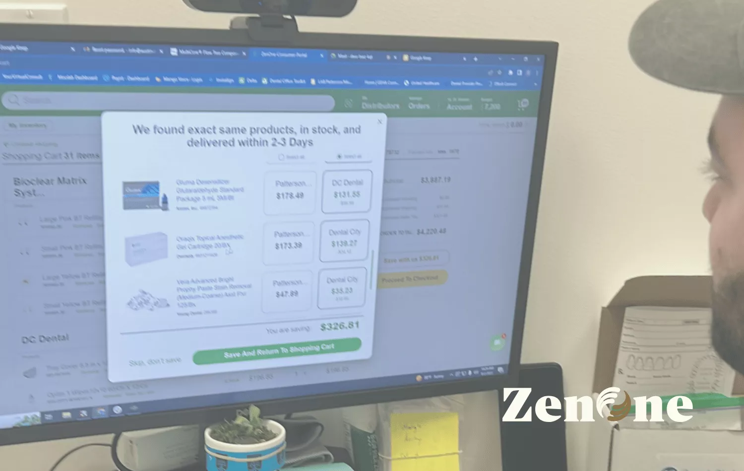 Photo of a desktop monitor showing a dental supply shopping/comparison pop-up on screen; a person is partially visible at right, ZenOne logo watermark in the lower right.
