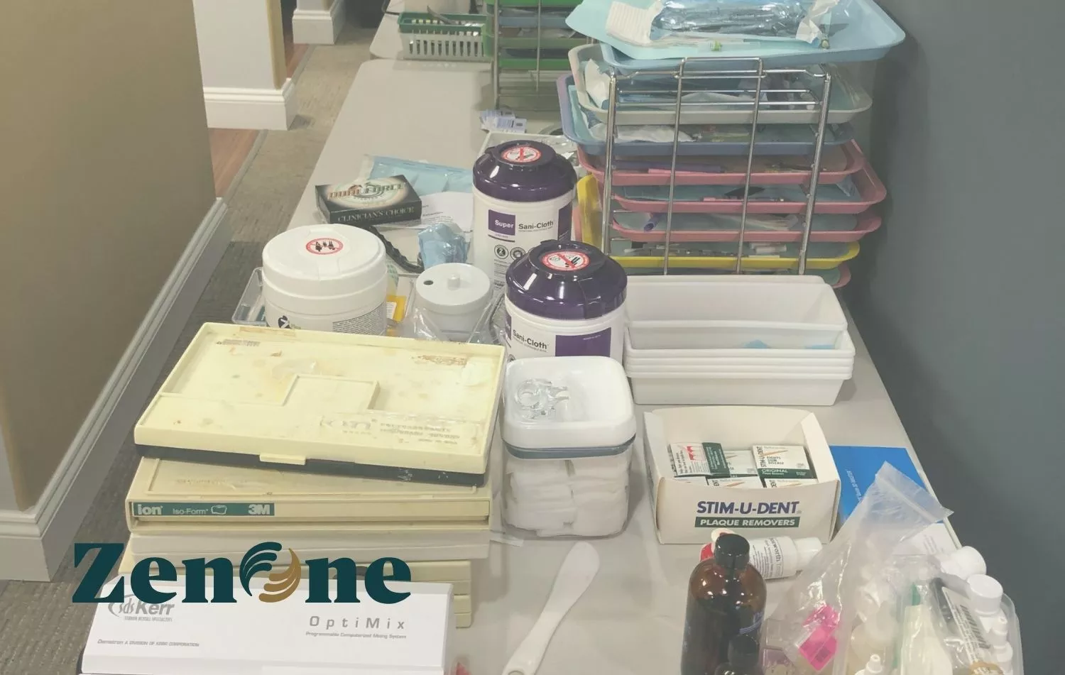 Dental office supplies and instruments organized on trays and containers, including disinfectant wipes, tools, gauze, and packaged items, illustrating real-world inventory management challenges.